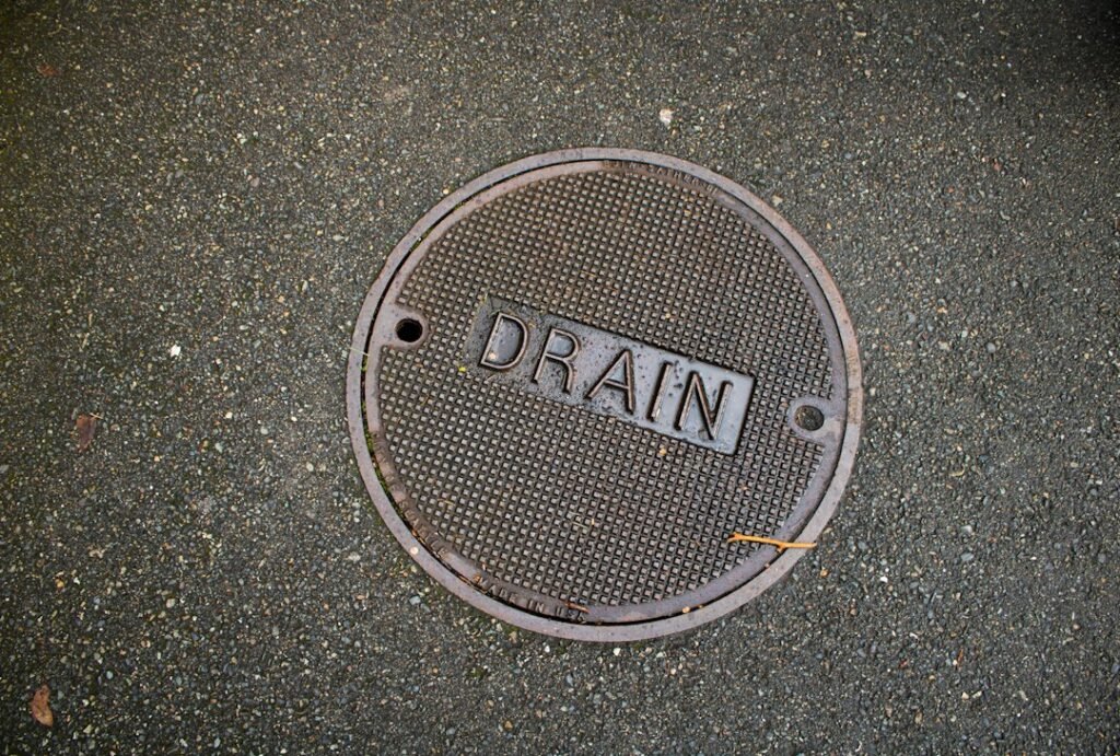 Outdoor drain cover beside a residential property